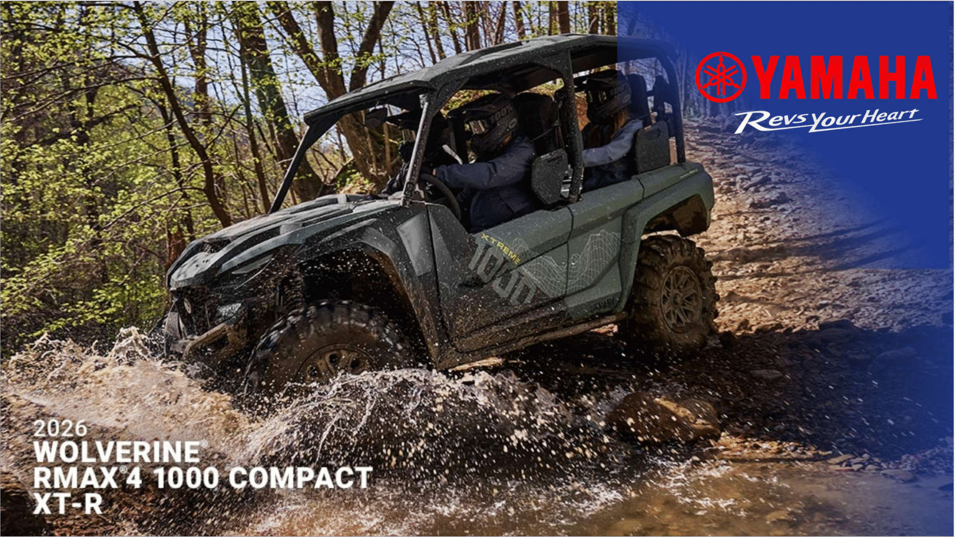 2026 Yamaha Wolverine RMAX4 1000 Compact XT-R side-by-side tearing through mud and water on a wooded trail